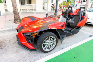 Miami Beach, Florida USA - April 15, 2021: red polaris slingshot sl, corner view.