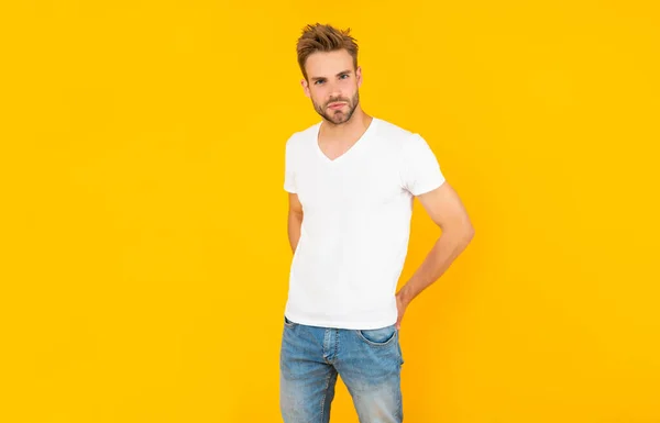 Handsome man in shirt on yellow background, mens beauty — Zdjęcie stockowe