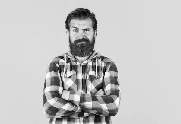 Facial care. portrait of handsome bearded man in plaid shirt. man wearing casual clothes. brutal serious man with beard standing indoor. Young and brutal. Confident and handsome brutal man — Stock Photo, Image