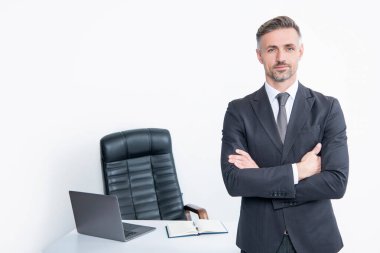 mature boss wear suit in office on white background