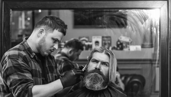 Become a Barber Superhero. client visiting hairdresser. Time for new haircut. man look at mirror reflection. mature handsome man with hair. barber or hairdresser tool. brutal hipster at barbershop — Stock Photo, Image