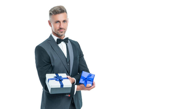 smiling man in tux with business reward box isolated on white