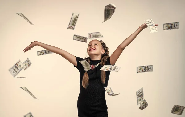 pure happiness. money. happy and wealthy childhood. financially secure future. cheerful kid with lots of dollar money cash. child isolated on white. currency. success. rich teen girl.