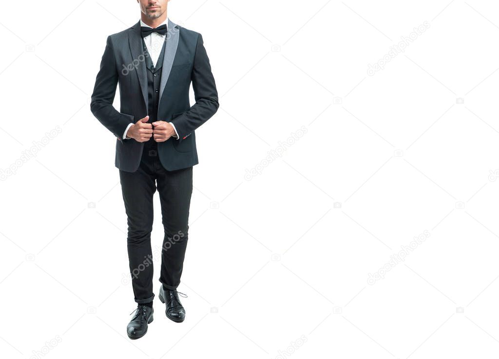 formal man in tuxedo bowtie isolated on white background. full length.