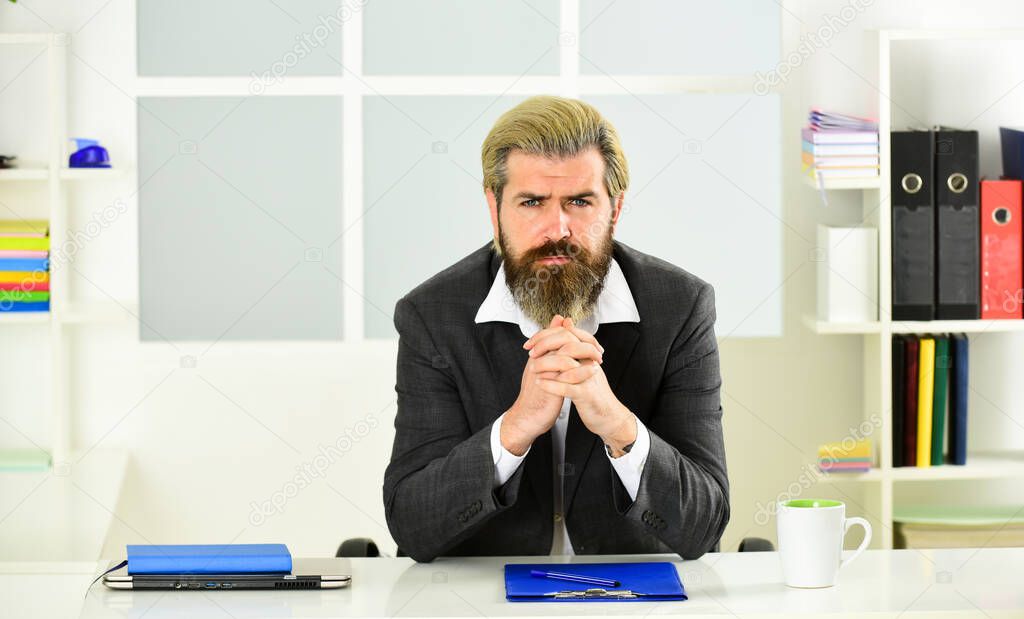 Inspired to work hard. bearded man in formal jacket sit at table. boss in workplace. modern office life. distant work while coronavirus quarantine. mature school teacher. Business-minded businessman.