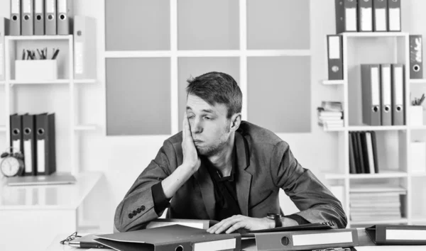 Man lawyer sleepy documents folders workplace, overwork problem concept.