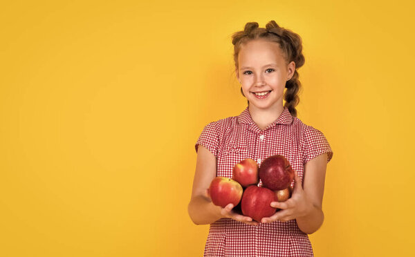 happy teen girl with red apple fruit, copy space, fruit.