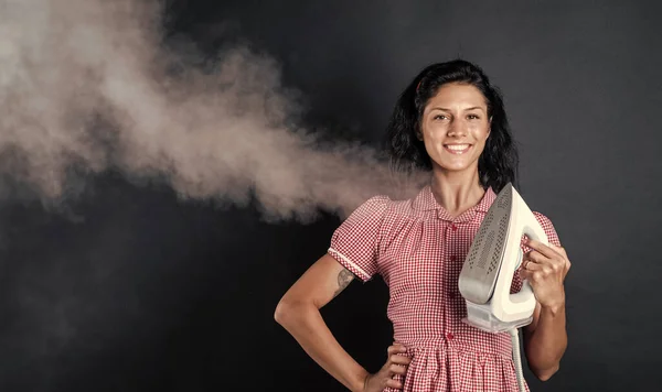 happy wife. vintage woman ironing clothes. housekeeping. pinup girl use steaming iron. home appliance. housekeeper woman ironing. happy and smiling housewife. retro girl with electric iron.