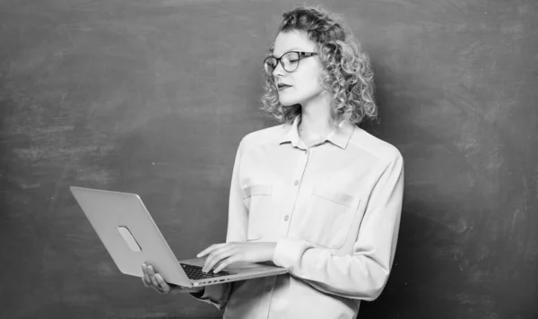 Remote job. Teacher notebook searching information chalkboard background. Online schooling concept. Woman laptop surfing internet. Online school. Teaching online course. Informatics and programming.