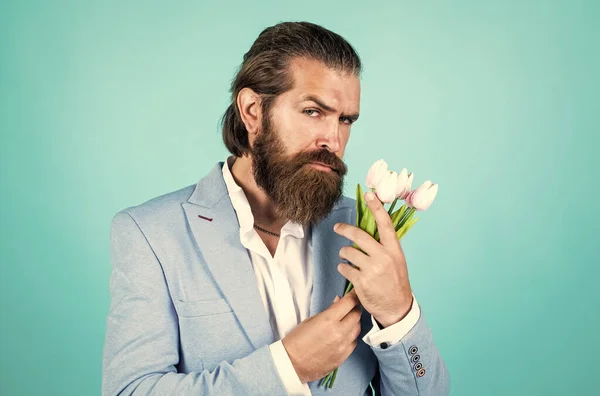 prepare for date. love date concept. bearded man in formalwear with tulip flowers. elegant businessman wear elegant apparel for formal event. spring present. true gentleman with bouquet.