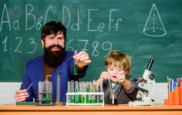 teacher man with little boy. School education. father and son at school. biology and chemistry education. Back to school. Educational concept. most excellent child of intellect and art.