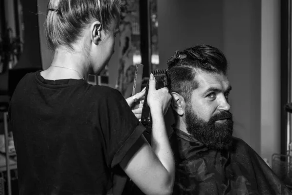barber master cut hair. mature hipster with beard at hairdresser. brutal hipster making new hairstyle. barbershop. male trendy hairdo. perfect haircut with blade razor. Confident in his perfect style.