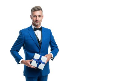 smiling mature man in suit with birthday present isolated on white.