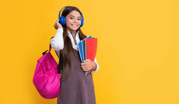 Happy Kid Headphones School Backpack Workbook Yellow Background — Stockfoto