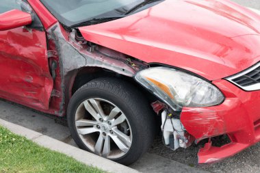 Seattle, Washington, USA - April 1, 2021: broken nissan car after road accident.