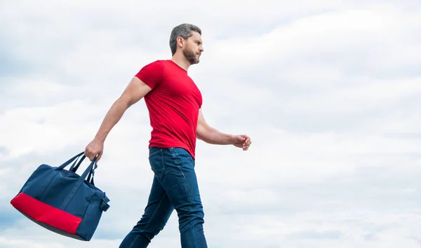 Active Guy Walking Sporty Bag Sky Background Copy Space — Stockfoto