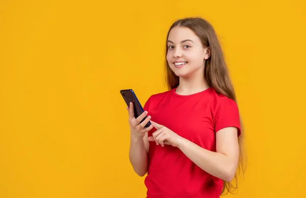 Cheerful Teen Child Smartphone Yellow Background — Stockfoto