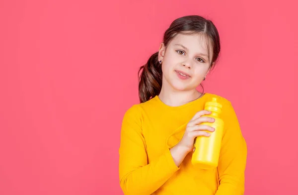 Smiling Kid Hold Water Bottle Pink Background — Stock Fotó