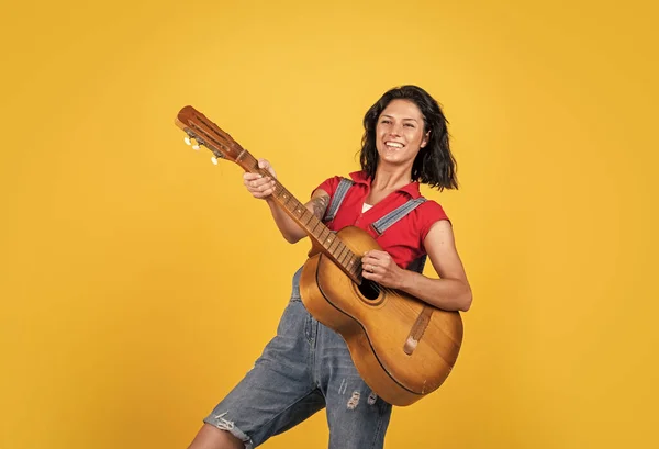 talented musician. Lifestyle and People Concept. playing the guitar. play on string instrument. having a party. Happy woman with acoustic guitar. music concept. Singing Songs.
