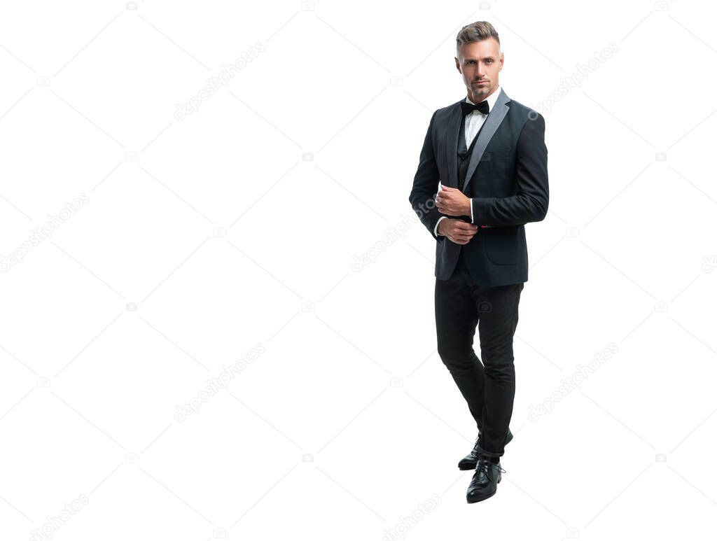 hoary formal man in tuxedo bowtie isolated on white background. full length.