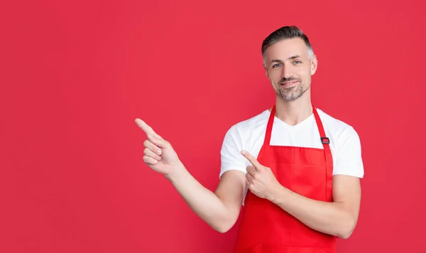 Mature Barista Apron Red Background Point Finger — ストック写真