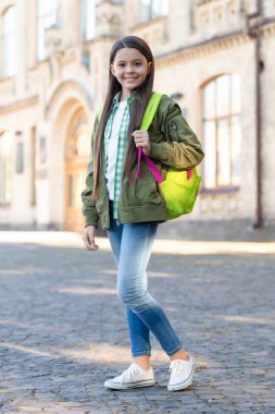 Happy teenage girl back-to-school on September 1, education.