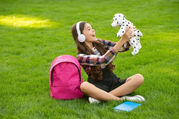Teenage Girl Singing Song Holding Dog Toy Grass School Music — Φωτογραφία Αρχείου