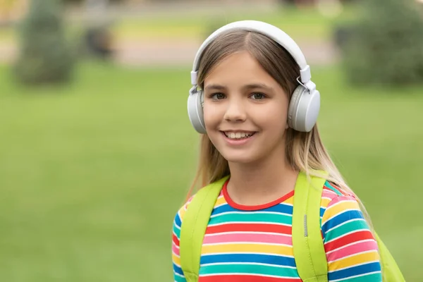 Happy School Girl Listening Music Headphones Outdoors Copy Space — Zdjęcie stockowe