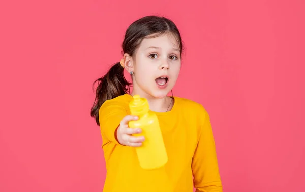Amazed Kid Hold Water Bottle Pink Background — Stockfoto