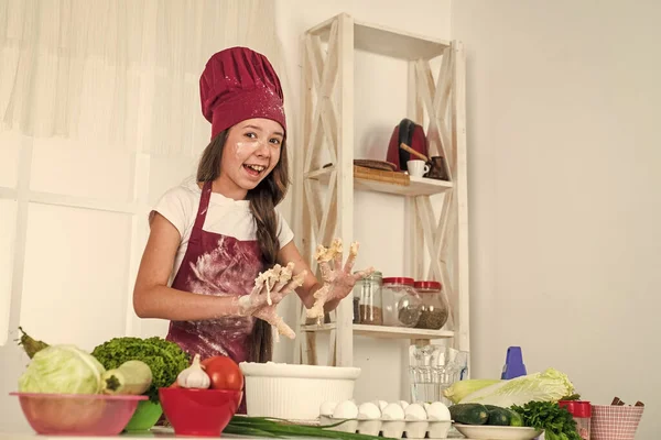 Getting food. ready to eat. healthy and organic food only. professional menu. teen girl chef wearing uniform. child study how to cook by recipe. kid cooking in kitchen. choosing future career.