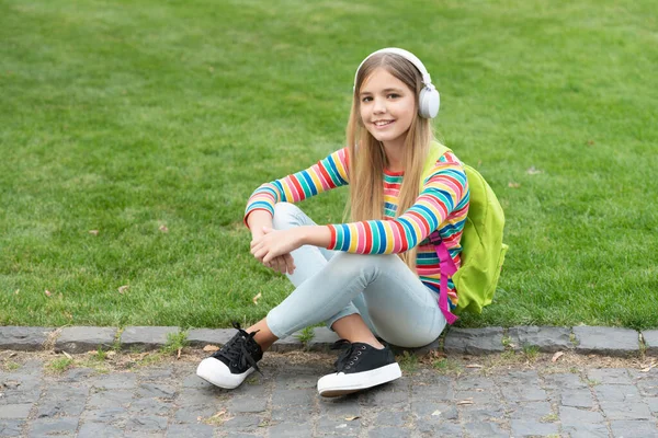 Happy Teen Girl School Backpack Listening Music Sitting Grass Outdoors — Foto Stock