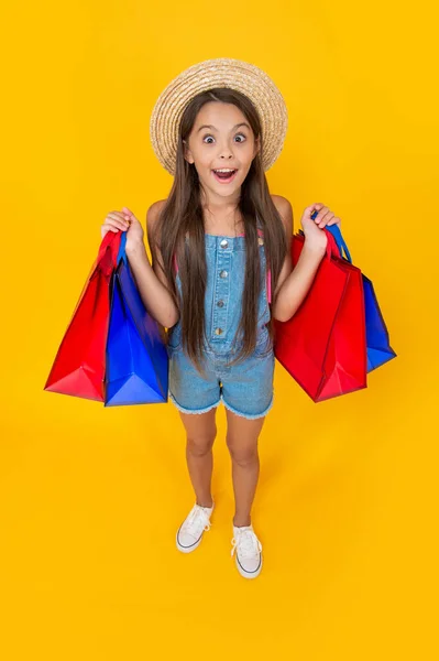 Full Length Amazed Teen Child Shopping Bags Yellow Background — Zdjęcie stockowe