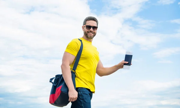 Man Traveler Holding Travel Bag Document Sky Background Vacation — стоковое фото