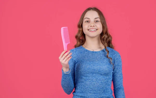 Cheerful Teen Girl Curly Hair Hold Comb Pink Background — Φωτογραφία Αρχείου