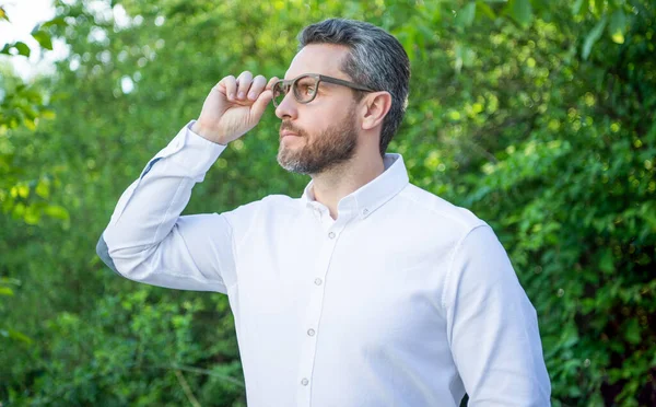 Professional Man Looking Distance Eyeglasses Natural Background Eyesight — Stockfoto