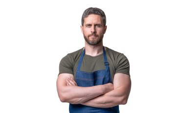 Confident man in apron keeping arms crossed standing isolated on white.