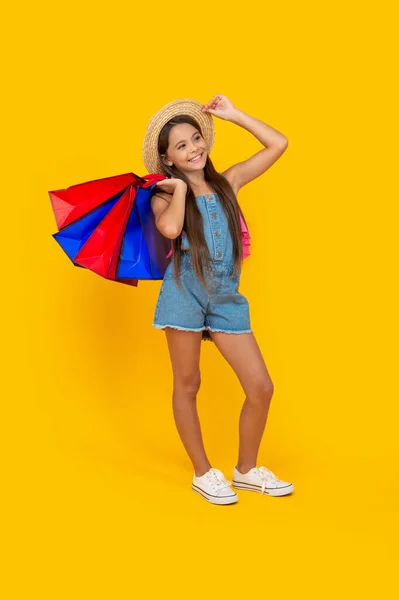 Positive Teen Child Shopping Bags Yellow Background Full Length — Stok fotoğraf