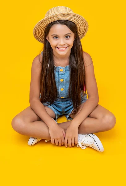 Positive Teen Girl Straw Hat Sitting Yellow Background — Foto Stock
