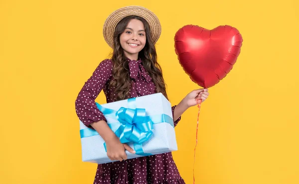 Cheerful Teen Child Red Heart Balloon Present Box Yellow Background — стоковое фото