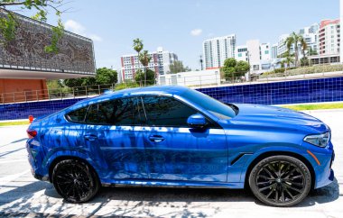 Miami Beach, Florida USA - April 15, 2021: blue bmw x6 sdrive 40i, side view.