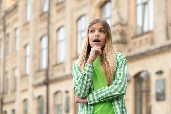 Surprised Teen Girl Looking Away Chin Hand Blurry Outdoors Copy — Zdjęcie stockowe