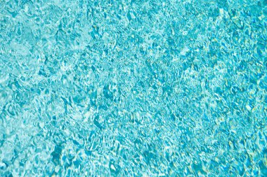 blue color background of swimming pool water with nobody in summer.