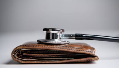 expensive medicine concept. stethoscope and wallet as symbol of expensive medicine. healthcare and medicine are expensive.