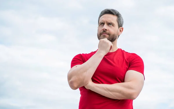 Pondering Man Red Shirt Outdoor Sky Background — Stockfoto