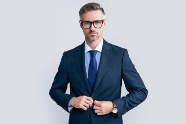 serious mature businessman in businesslike suit and glasses.