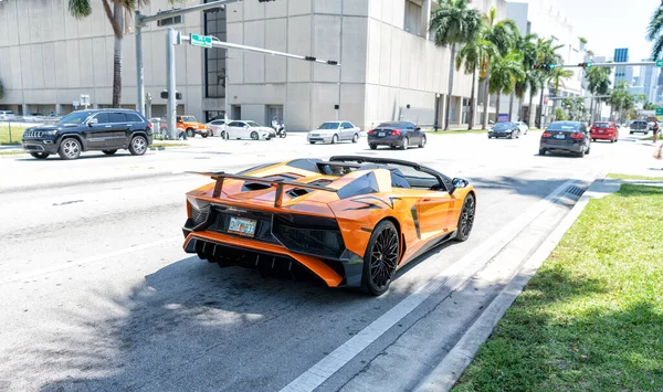 Miami Beach, Florida USA - April 15, 2021: orange Lamborghini Aventador LP 750-4 SV, back view.