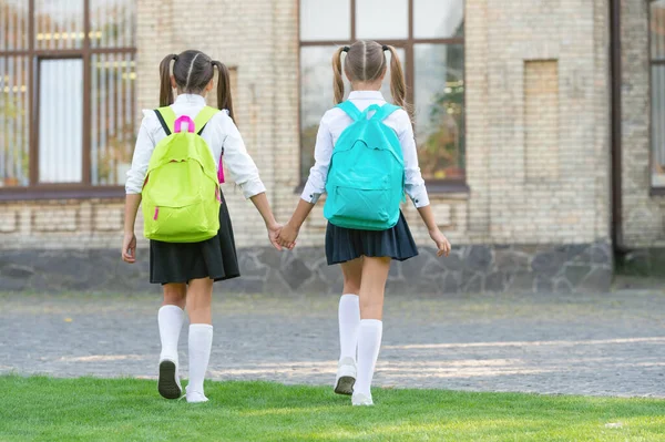 Back View Two Schoolgirls School Backpack Walking Together Outdoor Copy — Stockfoto