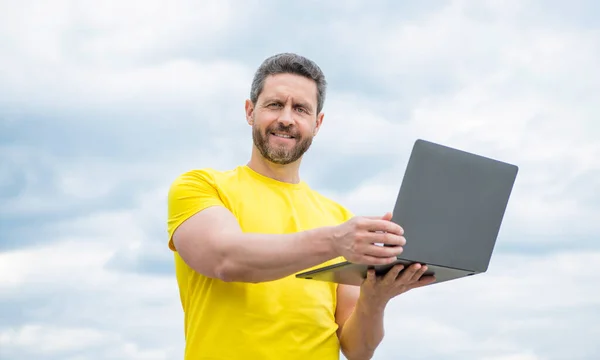 Smiling Man Working Online Laptop Sky Background —  Fotos de Stock
