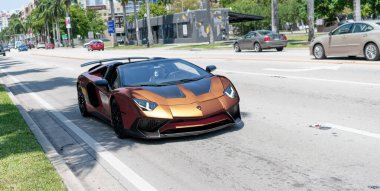 Miami Beach, Florida USA - April 15, 2021: brown Lamborghini Aventador LP 750-4 SV, front view.