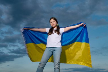 ukrainian teen girl. child with ukrainian flag. kid with ukrainian flag feel free.